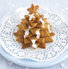 Biscuits stacked in shape of Christmas tree — Stock Photo