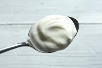 Spoonful of organic yogurt — Stock Photo