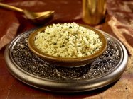 Closeup view of coriander with lemon  and cous cous — Stock Photo