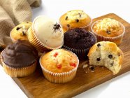 Various muffins on board — Stock Photo