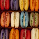 Box of multi coloured macaroons — Stock Photo