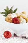 Strawberry doughnuts in bowl — Stock Photo