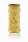 Bamboo shoots in a screw-top jar on white background — Stock Photo