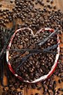 Coffee beans with vanilla pods — Stock Photo