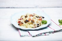 Spaghetti with vegetables and basil — Stock Photo