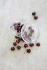 Fresh cherries with jar — Stock Photo