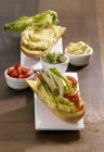 Avocado cream and sandwich — Stock Photo