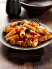 Rigatoni pasta with olives — Stock Photo