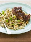 Pilau rice with pork chops — Stock Photo