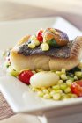 Black Cod with Succotash on white plate — Stock Photo