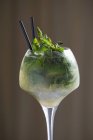 Mojito with mint in glass with cocktail straws — Stock Photo