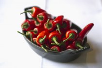 Fresh red chilli peppers — Stock Photo