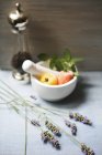 Elevated view of an arrangement with a mortar, pepper mill and lavender — Stock Photo