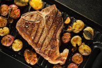 Porterhouse steak with potatoes — Stock Photo
