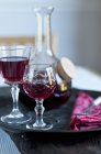 Glasses of red wine on tray — Stock Photo