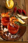 Gazpacho with prawn and rosemary skewers — Stock Photo