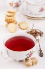 Floral tea with biscuits — Stock Photo
