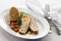 Roast veal studded with vegetables — Stock Photo