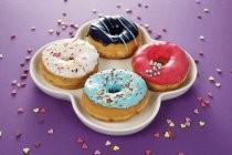 Four doughnuts with glaze — Stock Photo