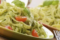 Tagliatelle pasta with pesto — Stock Photo