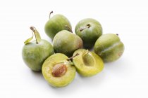 Whole and halved Greengages — Stock Photo