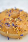 Doughnut decorated with dried flowers — Stock Photo