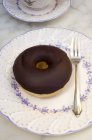 Chocolate-glazed doughnut — Stock Photo