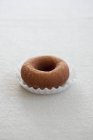 Fresh and sweet doughnut on table — Stock Photo