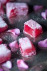 Closeup view of sliced pieces of Turkish Delight with rose petals — Stock Photo