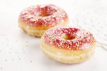 Doughnuts and sugar glaze — Stock Photo
