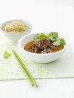 Meatballs in sauce with coriander — Stock Photo