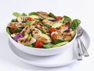 Grilled chicken salad with spinach — Stock Photo