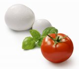 Tomato with basil and mozzarella — Stock Photo