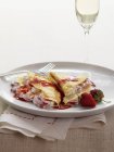 Strawberry crepes with strawberry syrup — Stock Photo