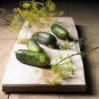 Gherkins and dill flowers — Stock Photo
