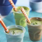 Broad bean cream with cumin in glass cups — Stock Photo