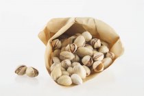 Pistachios in paper bag — Stock Photo
