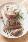 Peppered steak on plate — Stock Photo