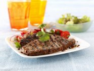 Grilled steak with salad — Stock Photo
