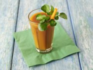 Carrot smoothie on napkin — Stock Photo