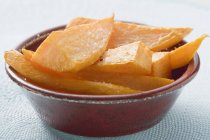 Deep-fried sweet potatoes in brown plate — Stock Photo