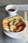 Vegetable tempura with soy sauce in bowls and chopsticks — Stock Photo