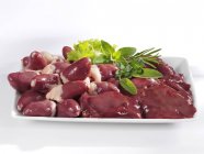 Fresh chicken hearts and livers — Stock Photo