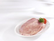 Fresh turkey breast on plate — Stock Photo