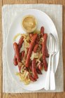Thin bratwurst sausages — Stock Photo