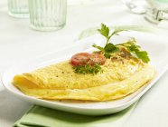 Cheese omelette on platter — Stock Photo
