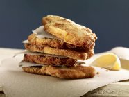 Stack of escalopes with lemon — Stock Photo