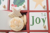 Christmas biscuits in Advent calendar — Stock Photo