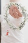 Woman holding Christmas wreath — Stock Photo