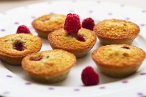Financiers with raspberries on the plate — Stock Photo